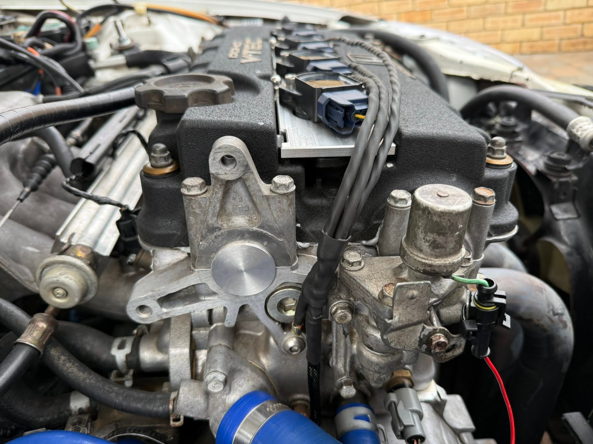 Machined cam plug installed where the B16 distributor was removed.